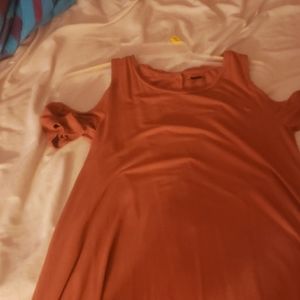 A maroon colored dress.